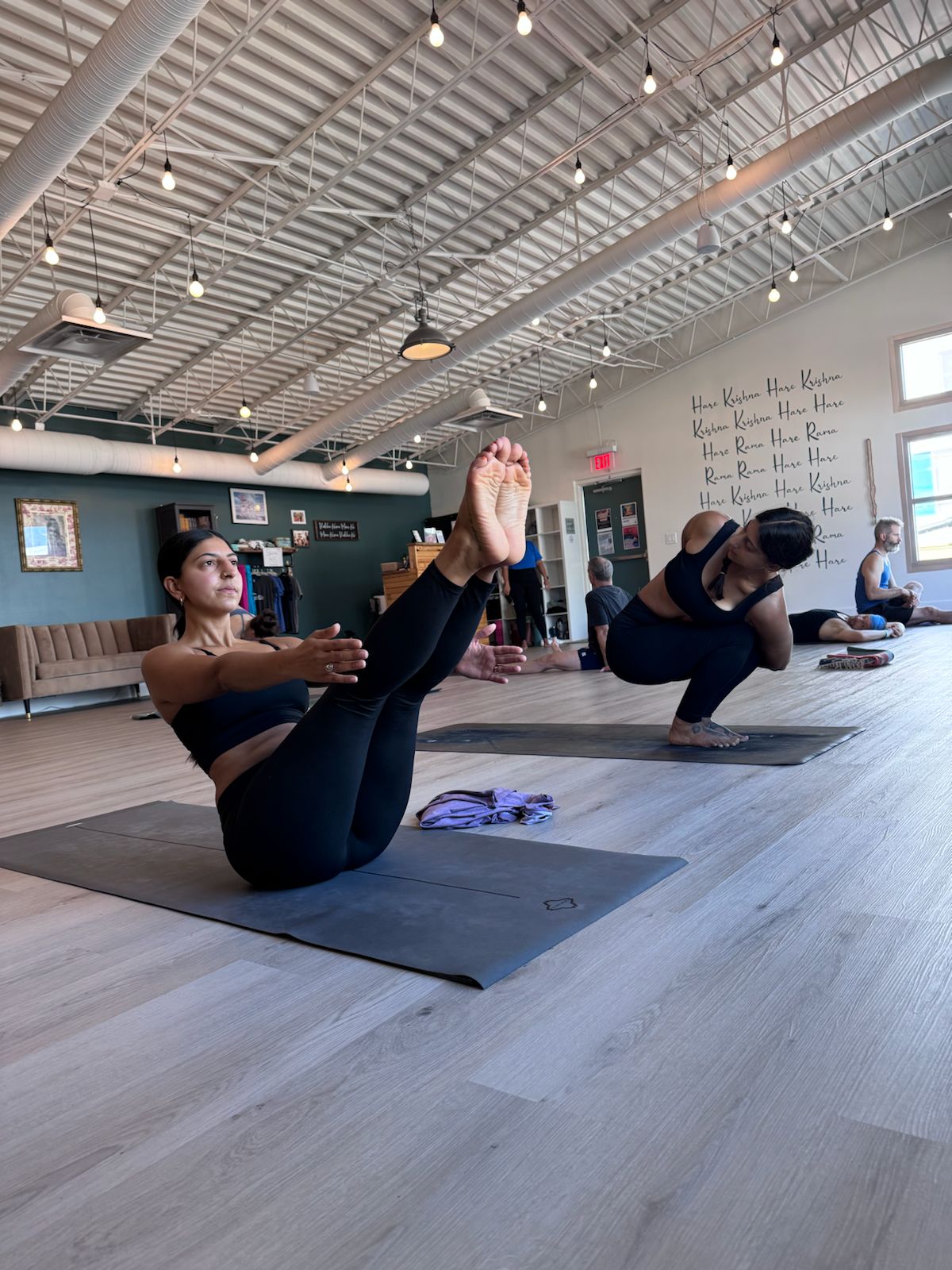 Ashtanga yoga practice - two sisters practicing yoga together in Nailsworth